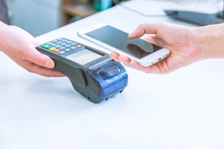 Close up of mobile payment in a shop.