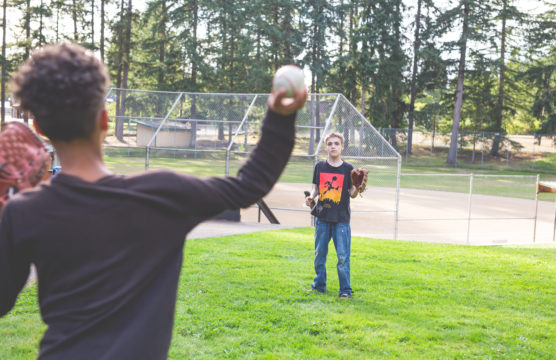 two boys playing catch