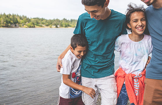 Young adults by the water.
