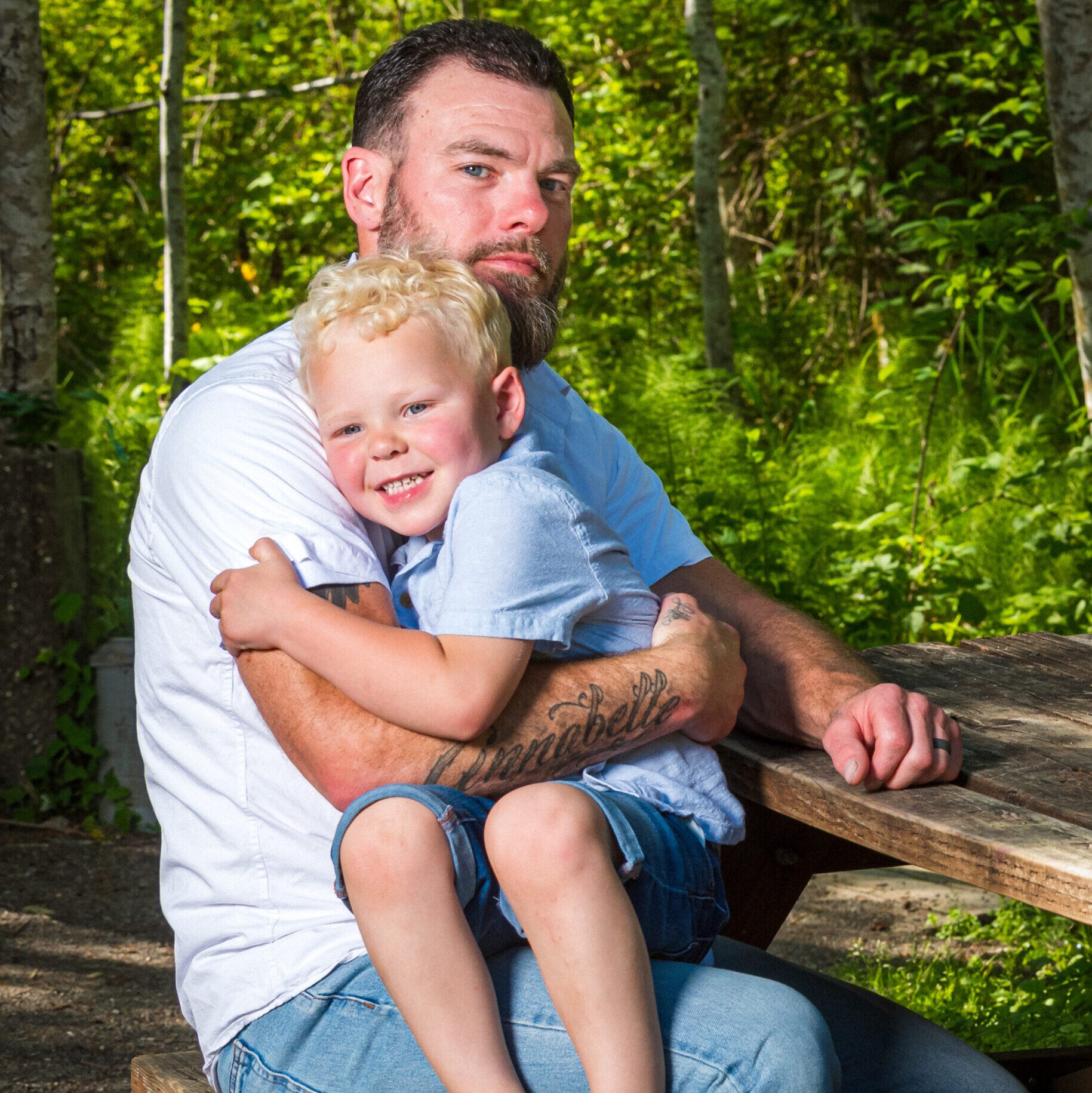 A father and son at a picnic table