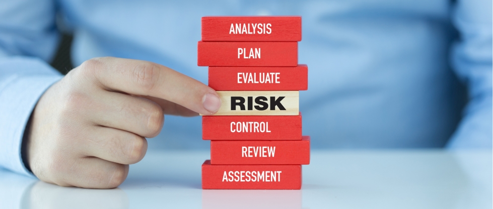 A stack of blocks that have the labels "analysis," "plan," "evaluate," "risk," "control," "review," and "assessment" on them