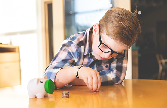 Boy counting his coins