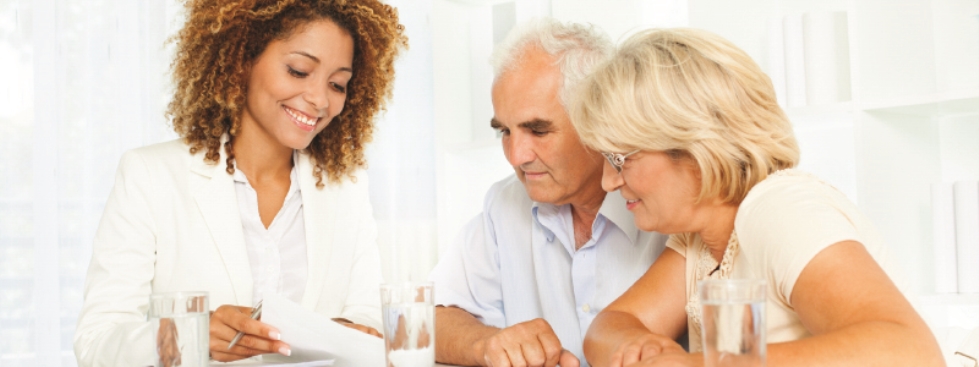 A couple talking to a financial planner