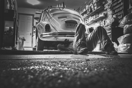 man working on car