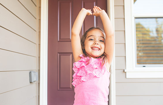 happy girl raising her arms