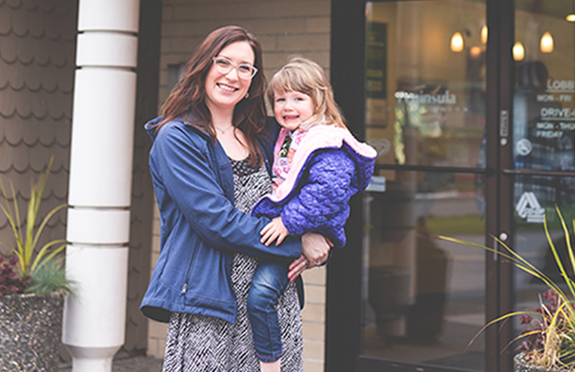 Smiling woman with little girl