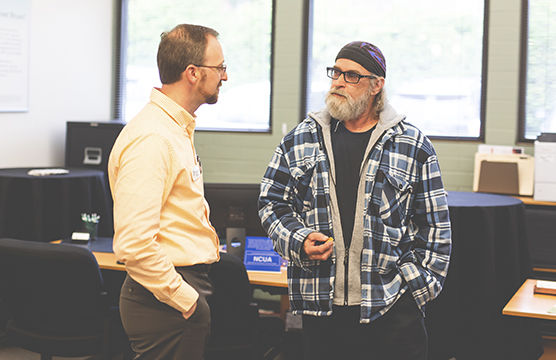 Banker talking to an older man
