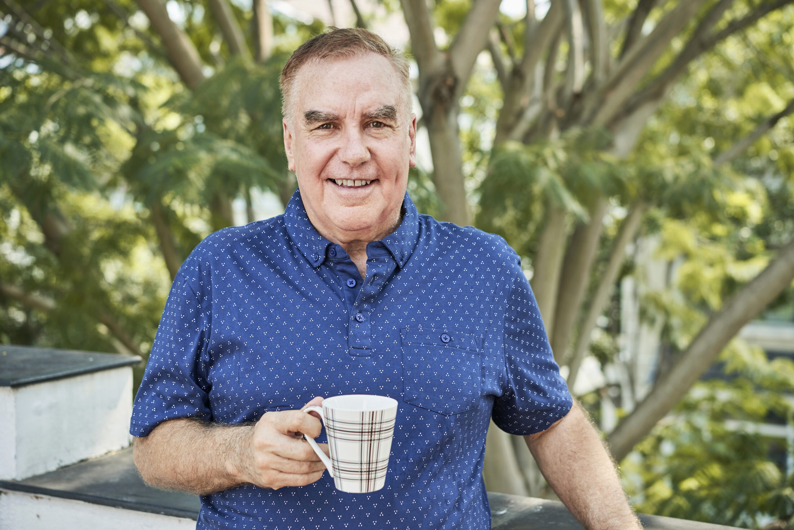 Positive man with tea cup